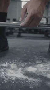 Athlete deadlifting in a gym, created with VideoGen